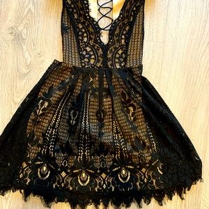 Sexy Scalloped Black Lace Cocktail Dress with Open Criss-Cross Back. Size S